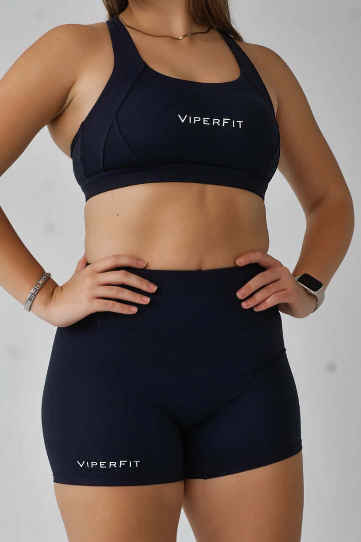 ViperFit Pulse Shorts - Navy Blue worn with matching sports bra, showcasing a high waisted and minimal design.